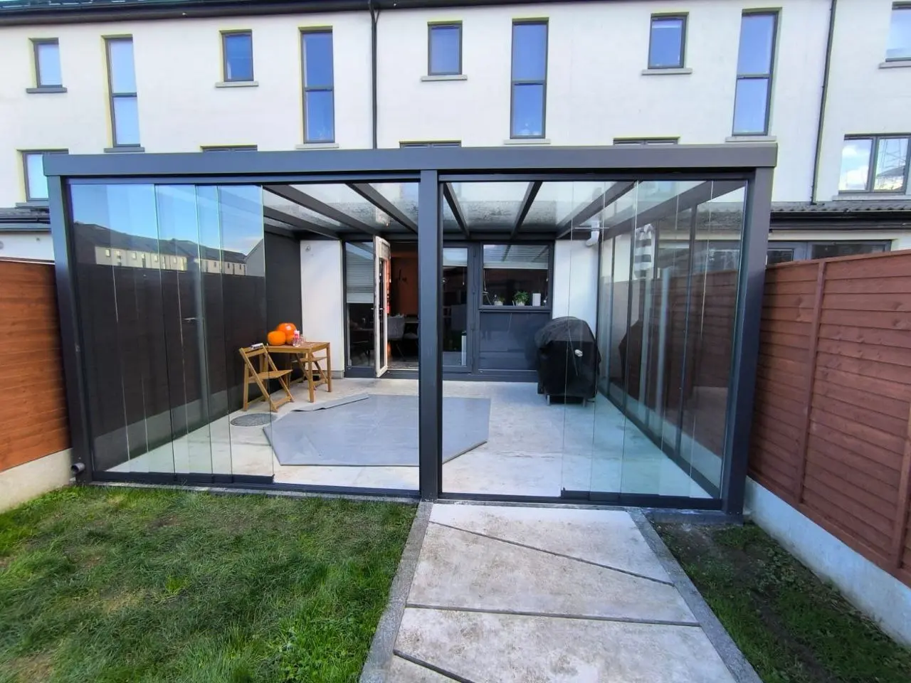 Front view of the completed glass pergola and sliding glass doors in Dublin