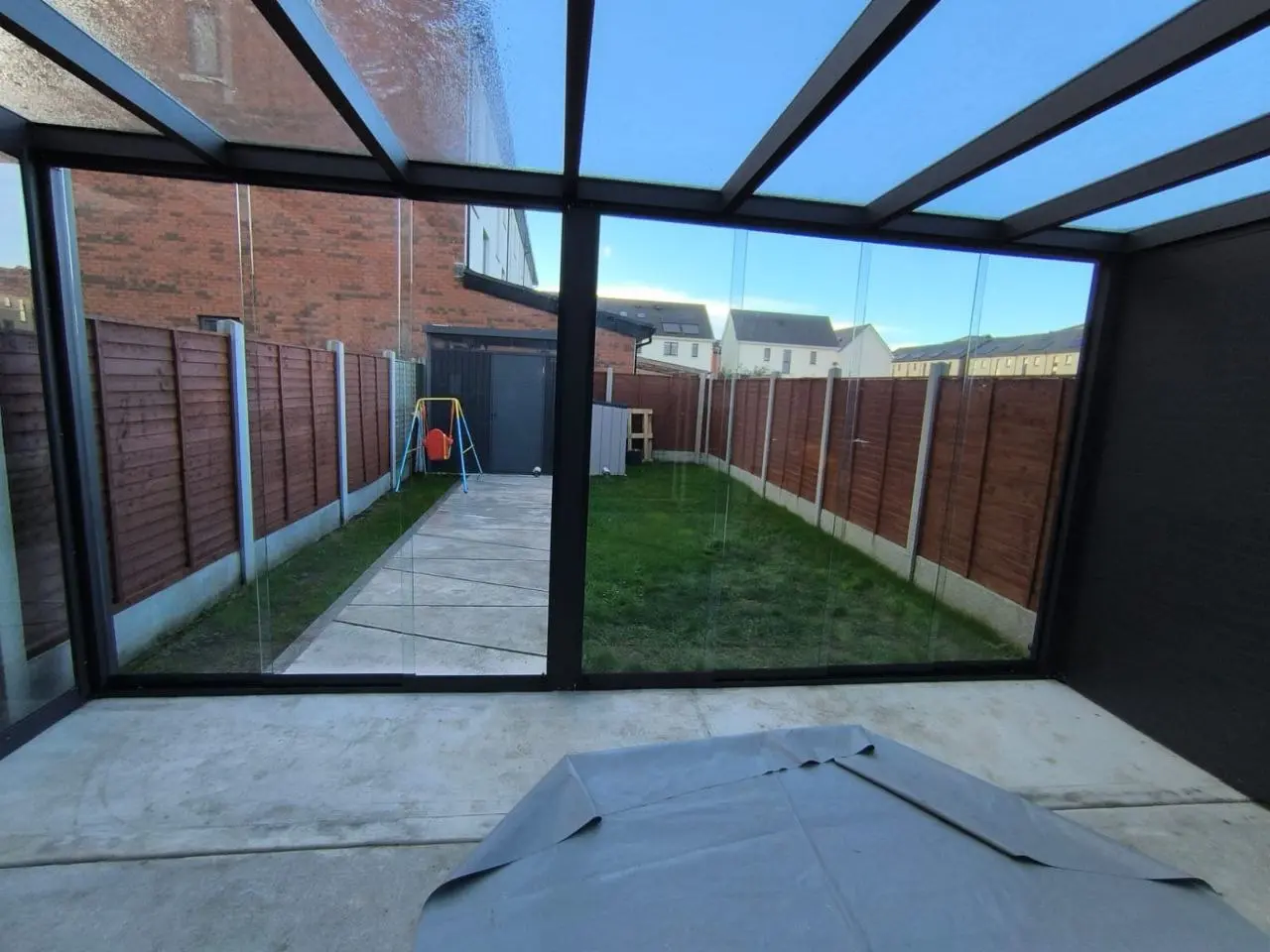 View from inside the Dublin pergola through the frameless sliding glass panels