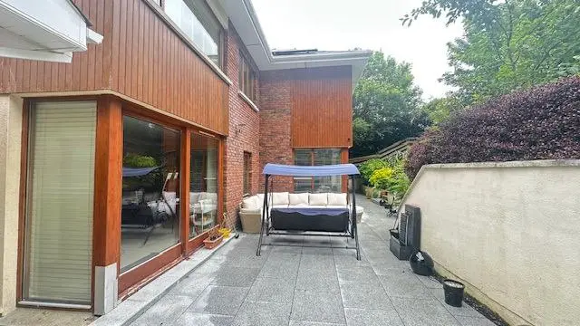 Rear patio and garden furniture before installation of the wall-mounted pergola