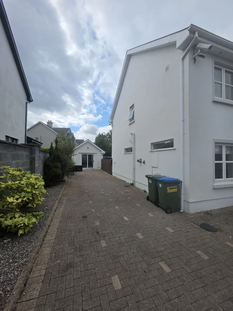 Driveway beside the Ennis home before installation of the motorhome carport