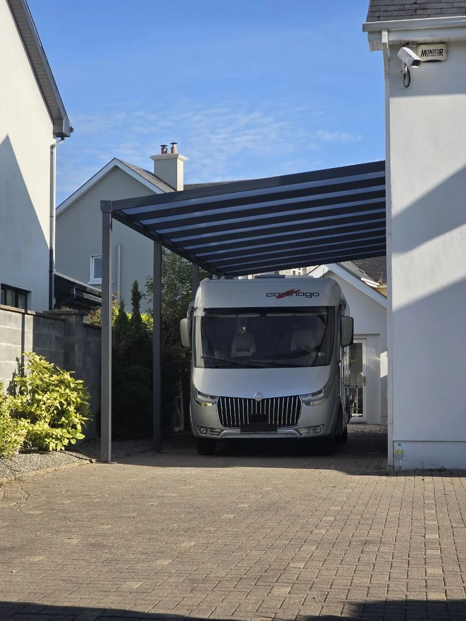 Black wall-mounted aluminium motorhome carport completed in Ennis, County Clare