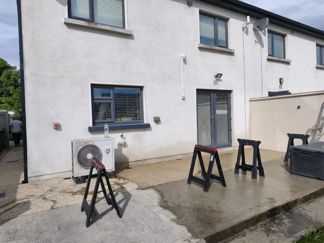 Existing concrete patio in Rathdrum before installation of the wall-mounted pergola