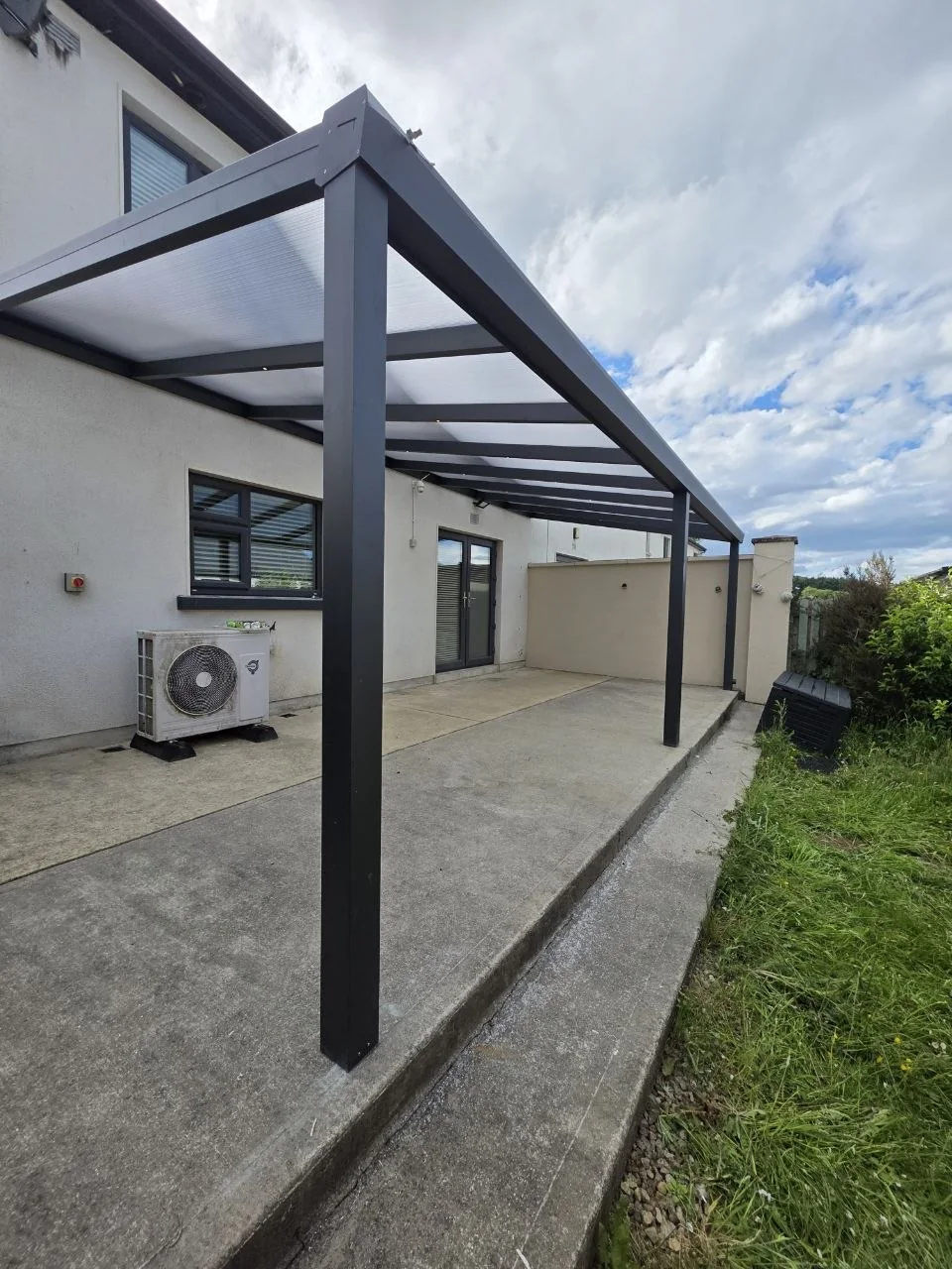 Side view of the open-sided wall-mounted aluminium pergola in Rathdrum, Wicklow