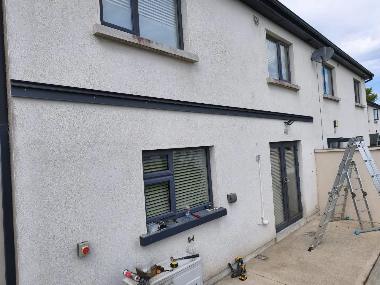 Wall beam installation for the made-to-measure patio pergola in Rathdrum