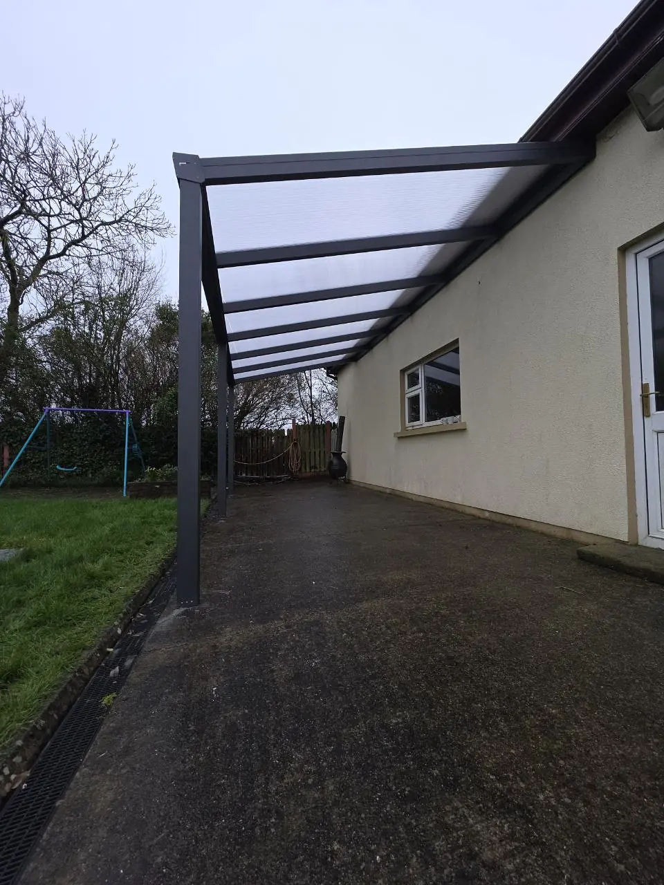 View beneath the completed light-diffusing polycarbonate pergola roof