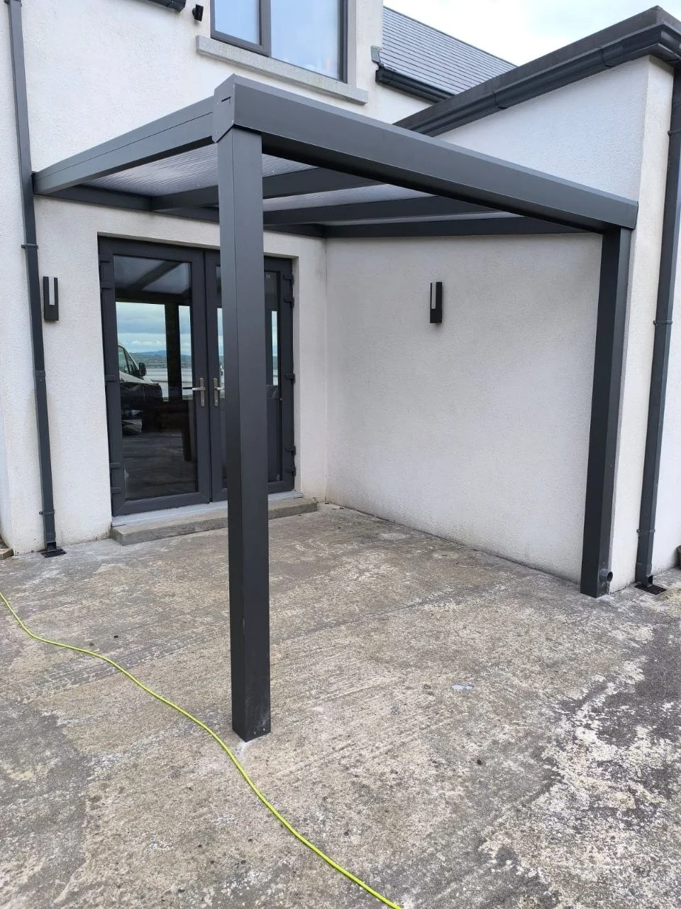Angled view of the completed aluminium entrance canopy beside the home in County Waterford