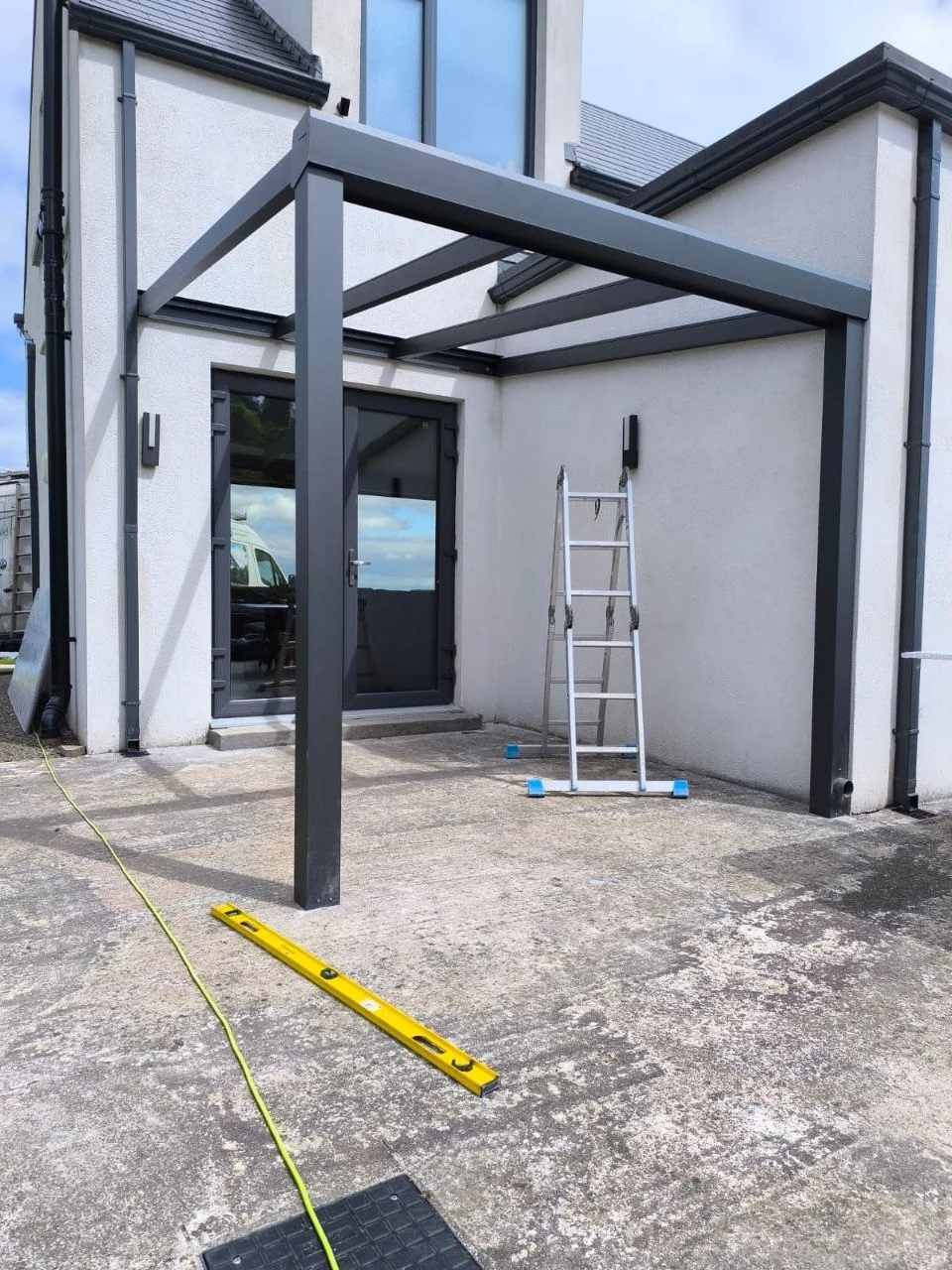 Anthracite aluminium canopy frame during installation at the residential property in Waterford