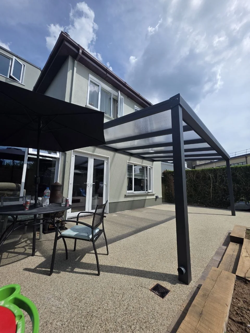 Angled view of the wall-mounted aluminium patio pergola completed in Galway