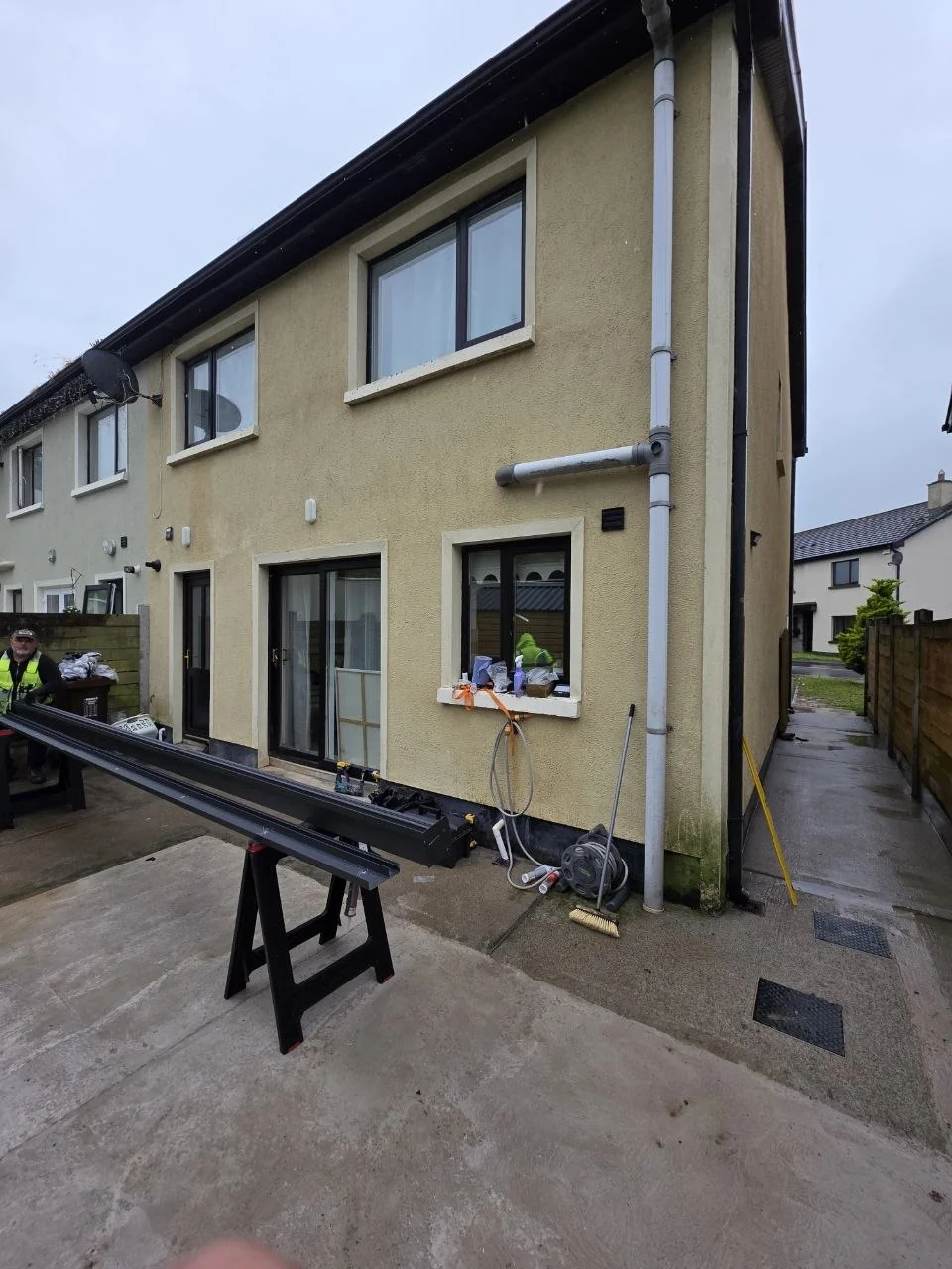 Rear patio in Newport, County Tipperary before installation of the wall-mounted pergola