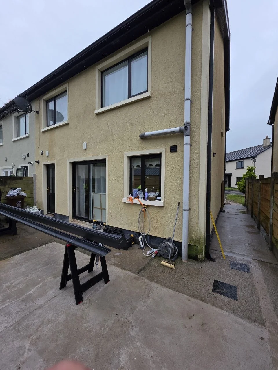 Anthracite aluminium pergola frame during installation at the Newport property