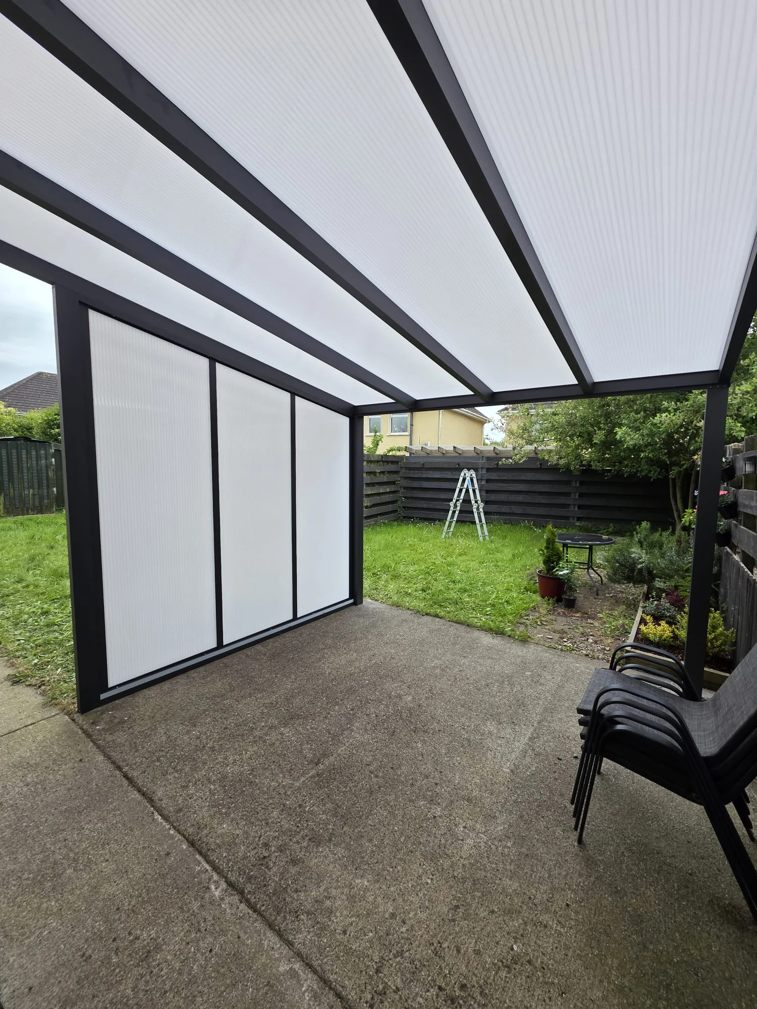 View beneath the opal polycarbonate roof covering the residential patio in Portlaoise