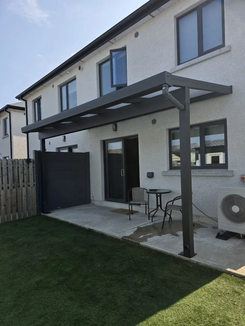 Angled view of the completed aluminium pergola over the rear patio