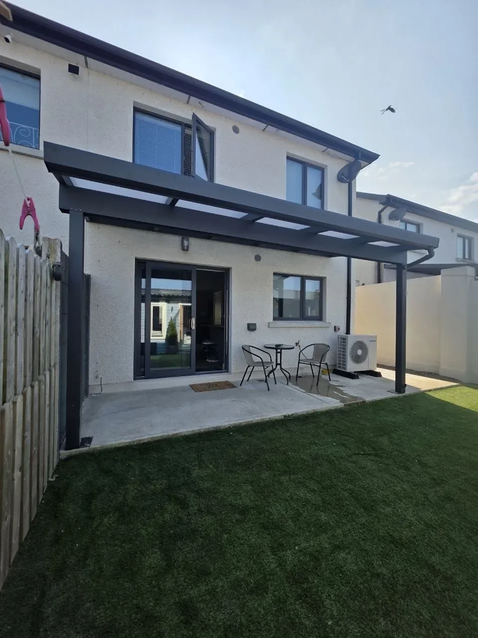 Front view of the anthracite grey wall-mounted pergola in Rathdrum