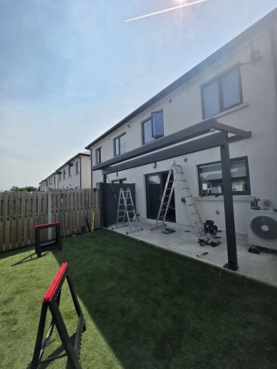 Anthracite aluminium pergola frame during installation in Rathdrum