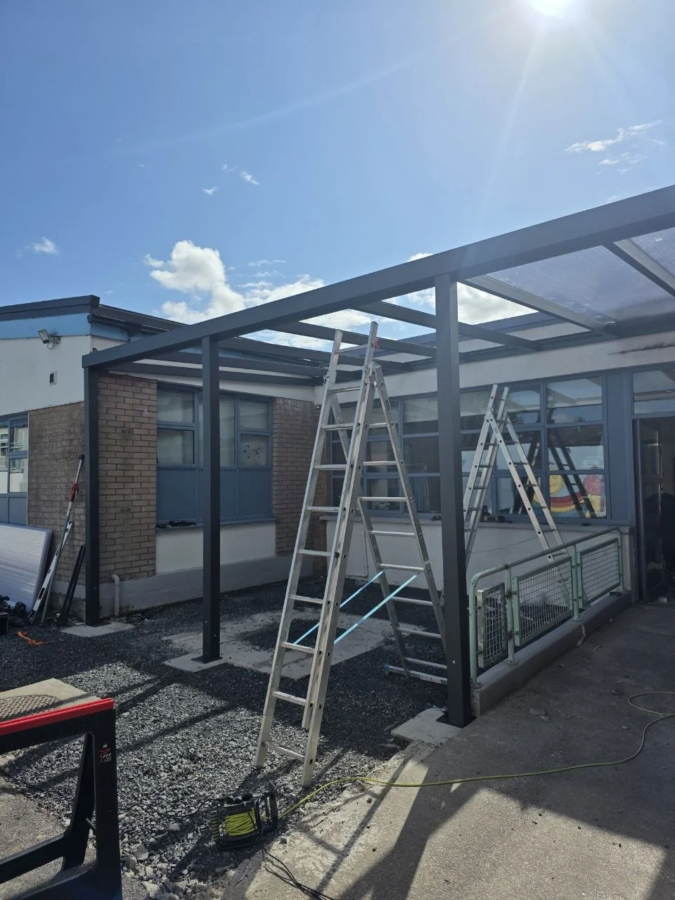 Aluminium school entrance canopy during installation in Cashel, County Tipperary