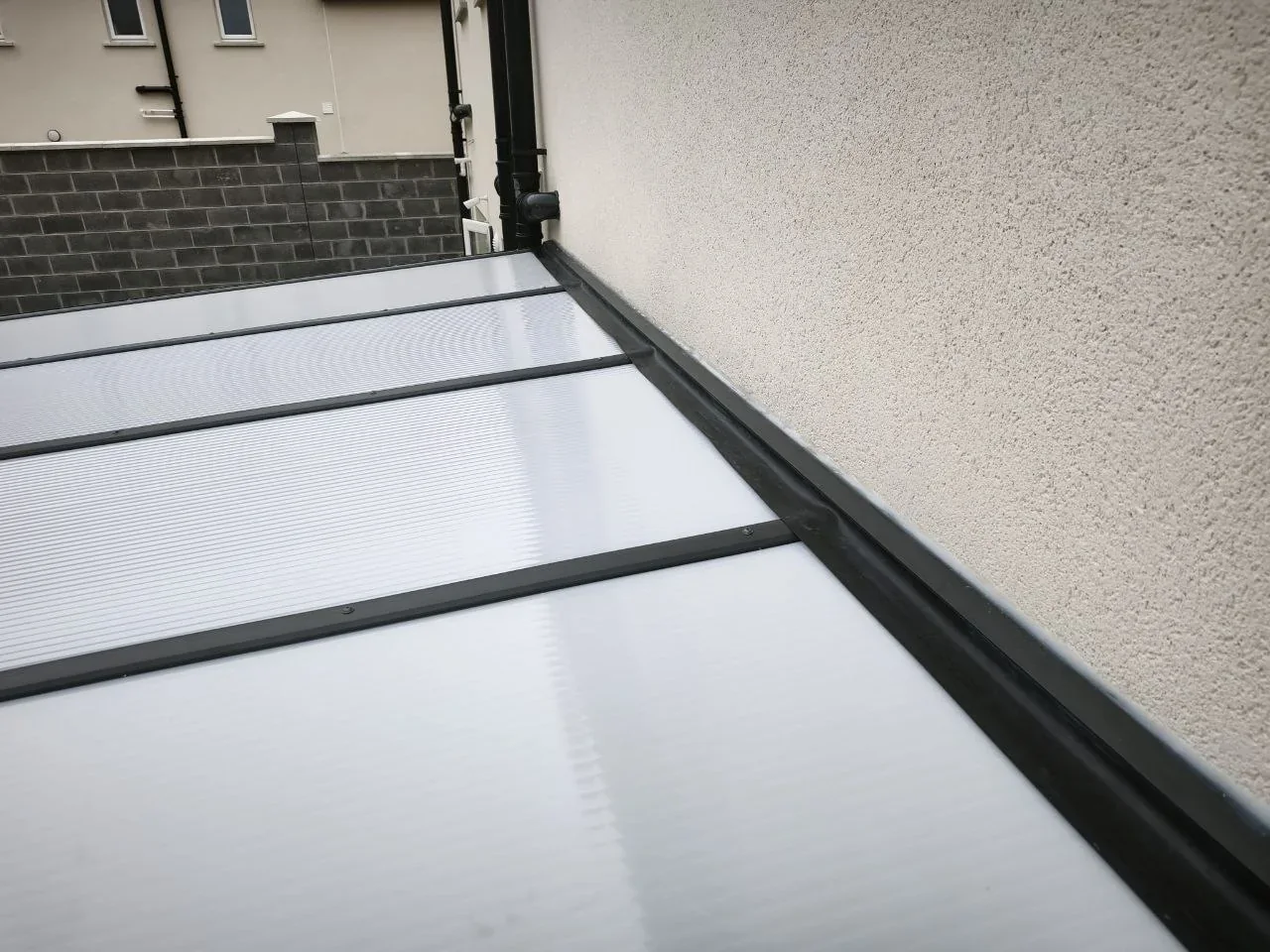 Milk polycarbonate roof detail on the completed residential pergola in Cork